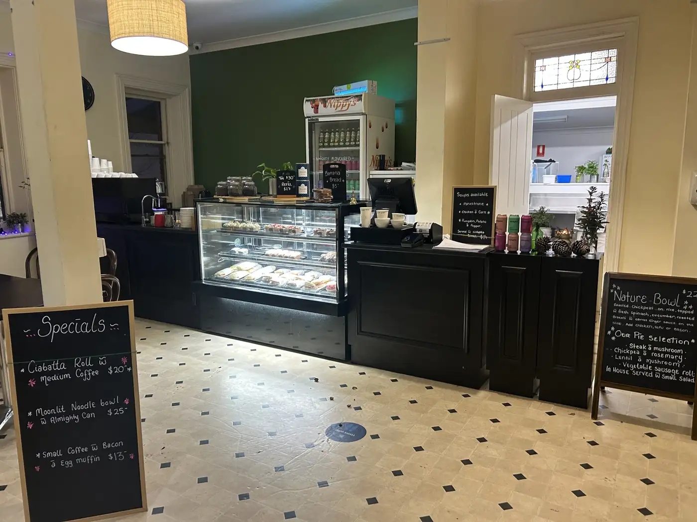 Inside Nature's Table Cafe — counter display case with fresh pastries in our charming stone cottage