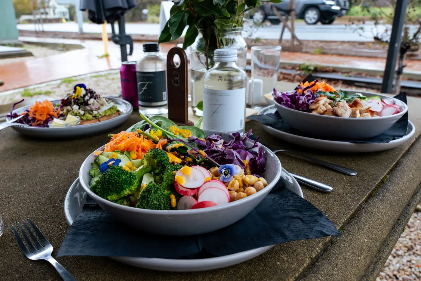 Fresh nourish bowls with locally sourced vegetables and edible flowers